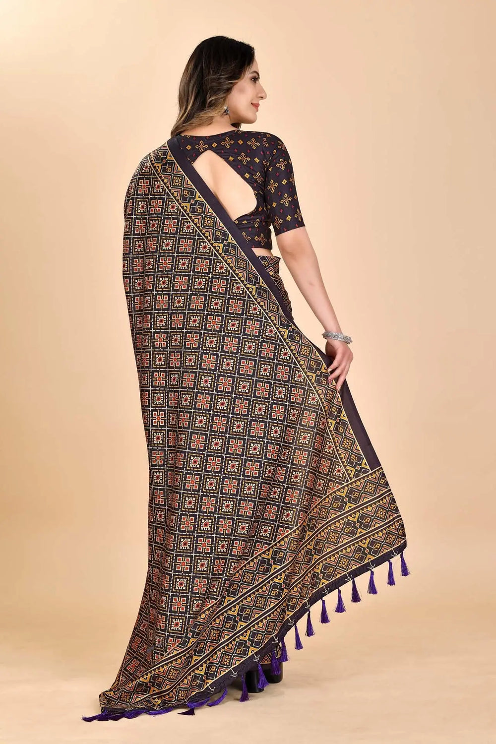 Woman wearing a cube Patola printed saree.