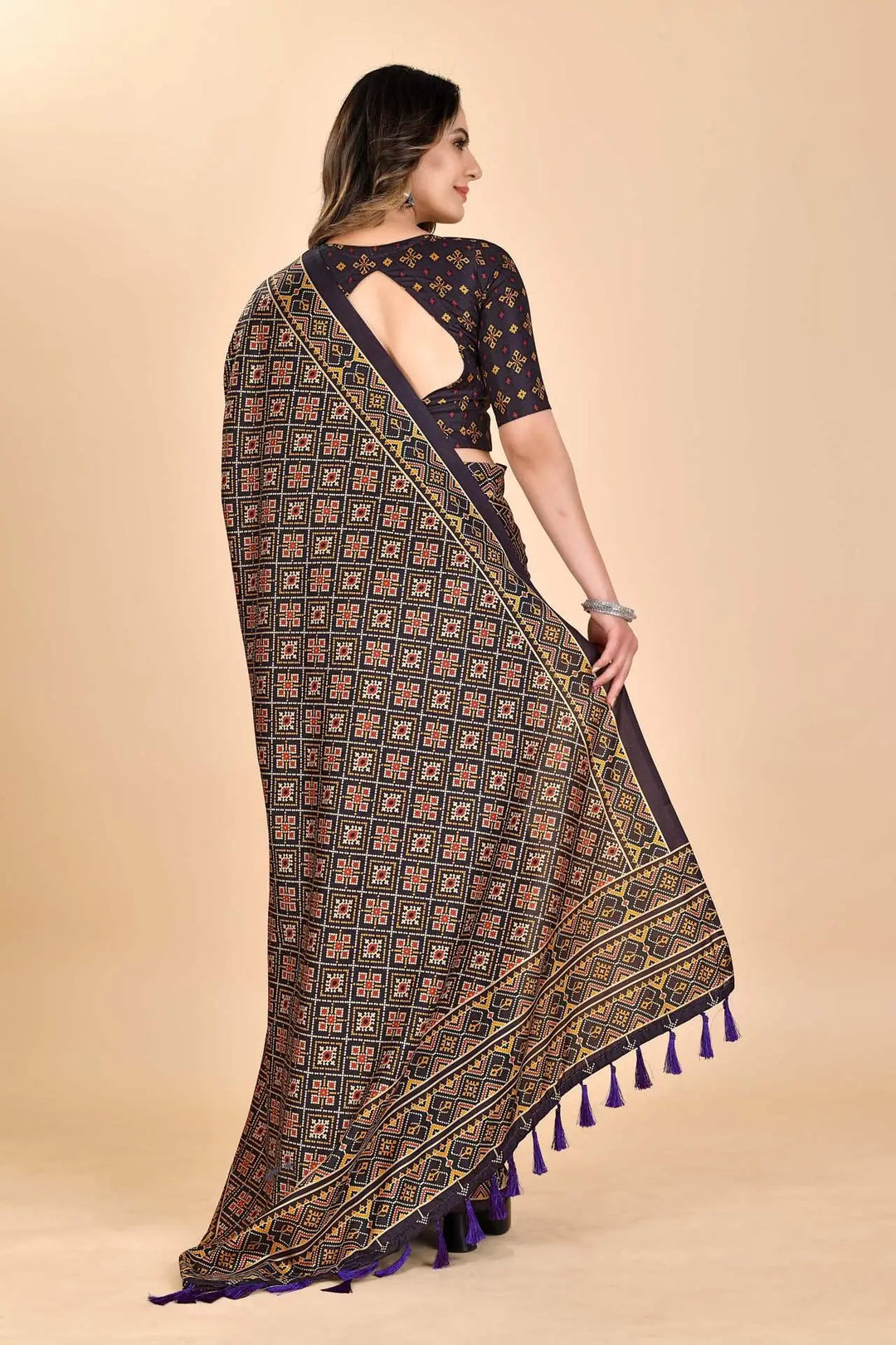 Woman wearing a cube Patola printed saree.