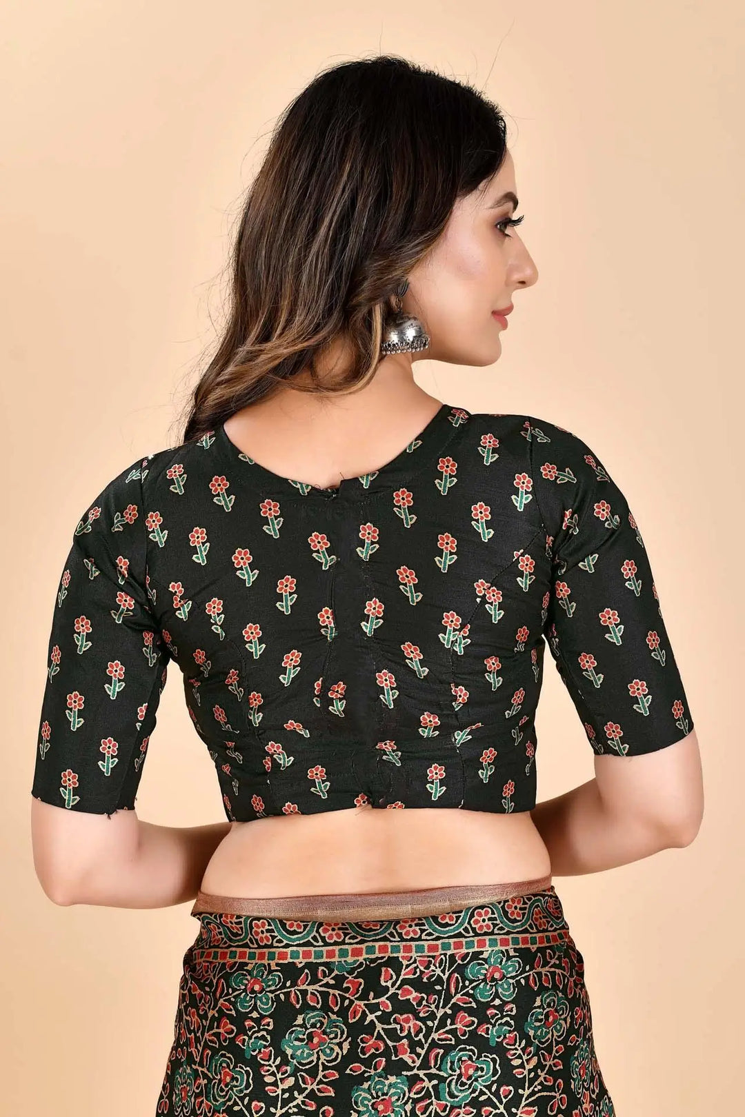 Woman wearing a Ajrakh butti Blouse.