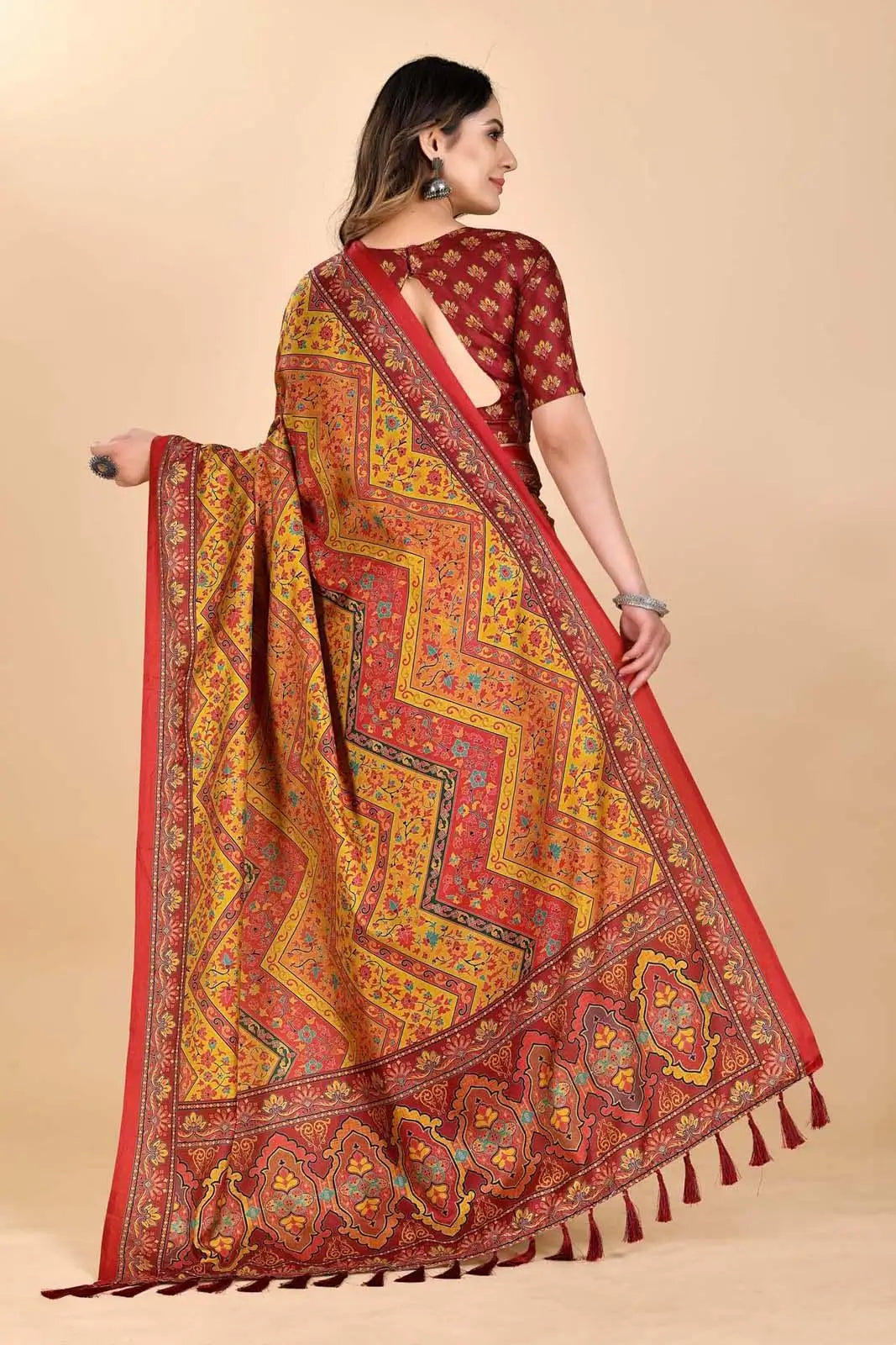 Woman wearing a red and yellow patterned Manipuri Printed Saree.