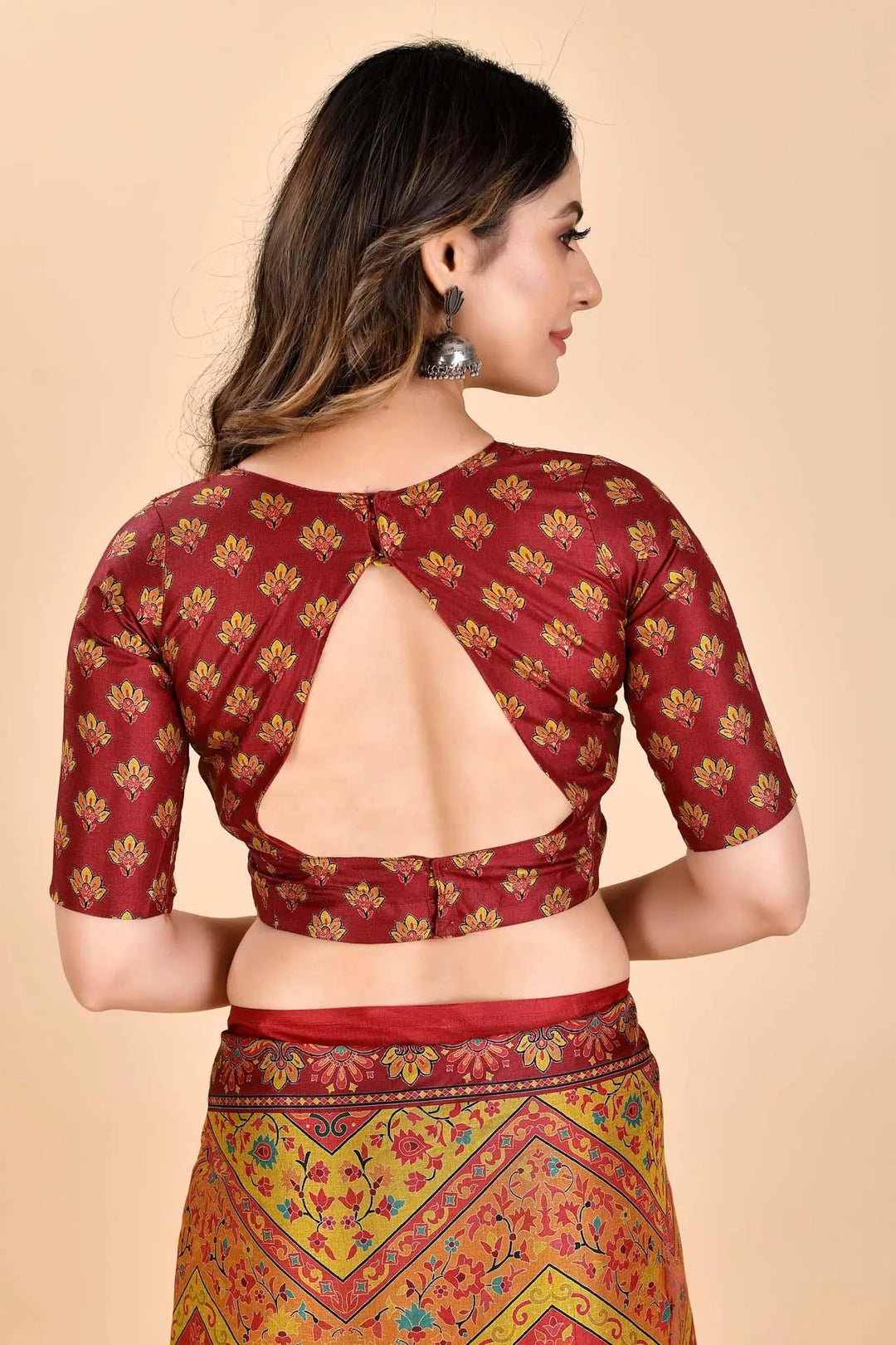 Woman wearing a maroon Manipuri Printed Sarees Blouse.