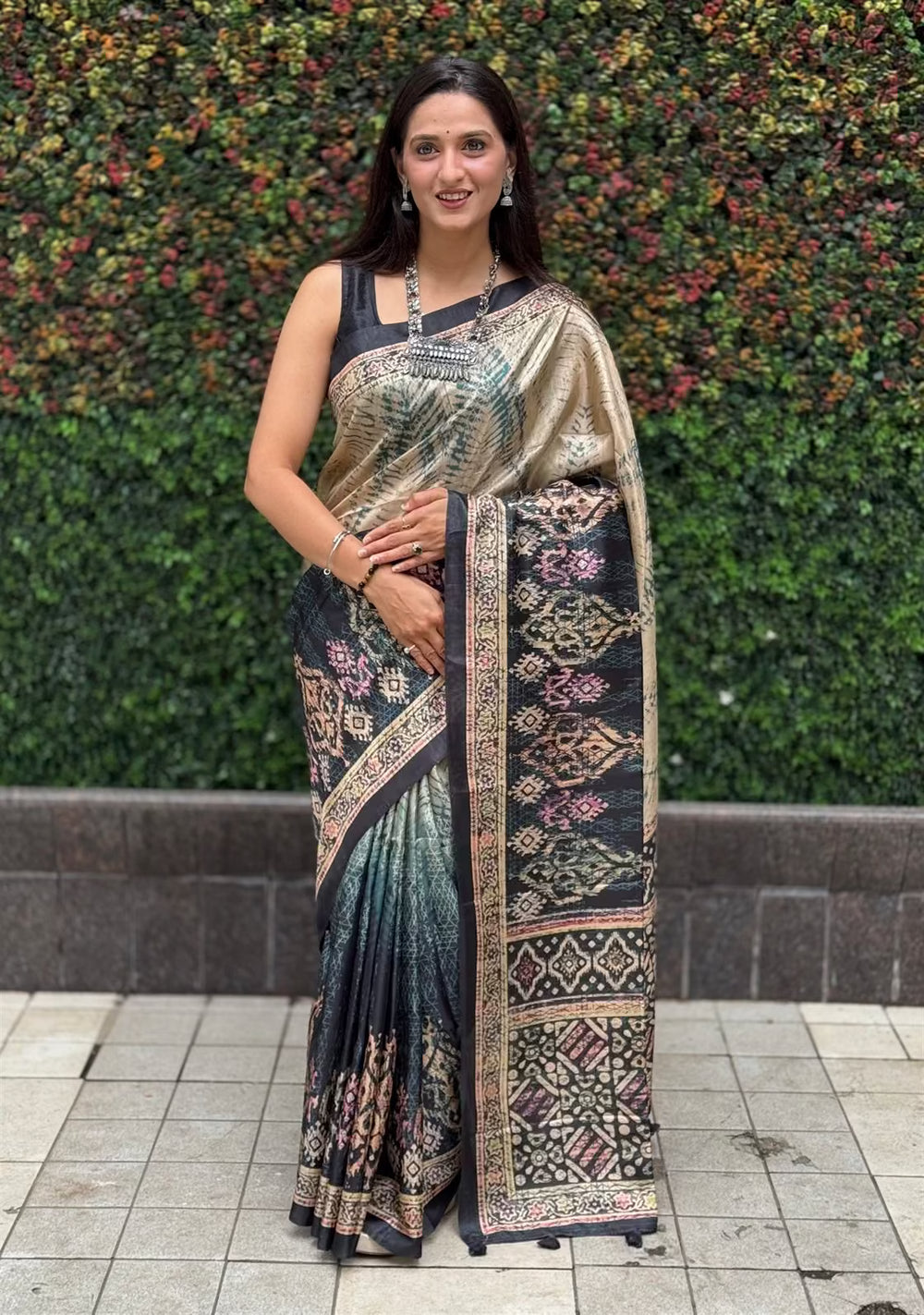 Woman wearing ikkat printed saree in Multicolour.