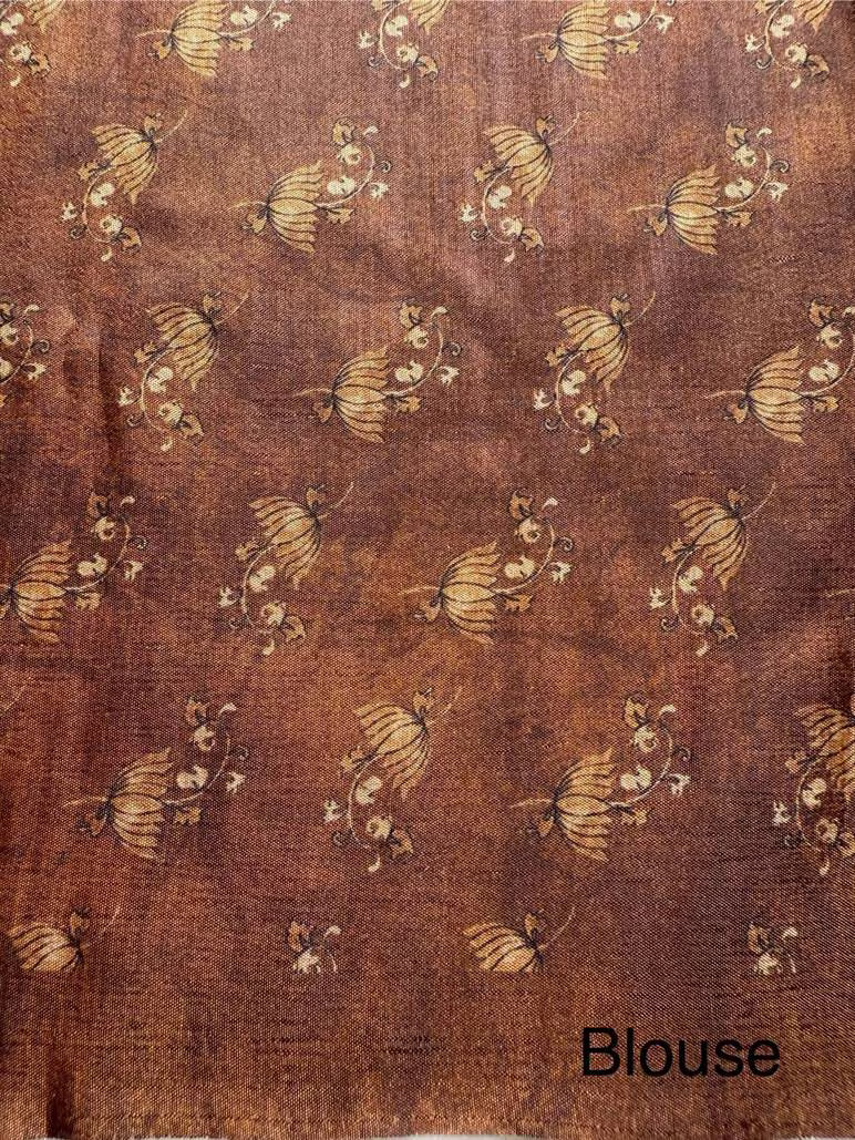 Brown toned printed blouse for woman.