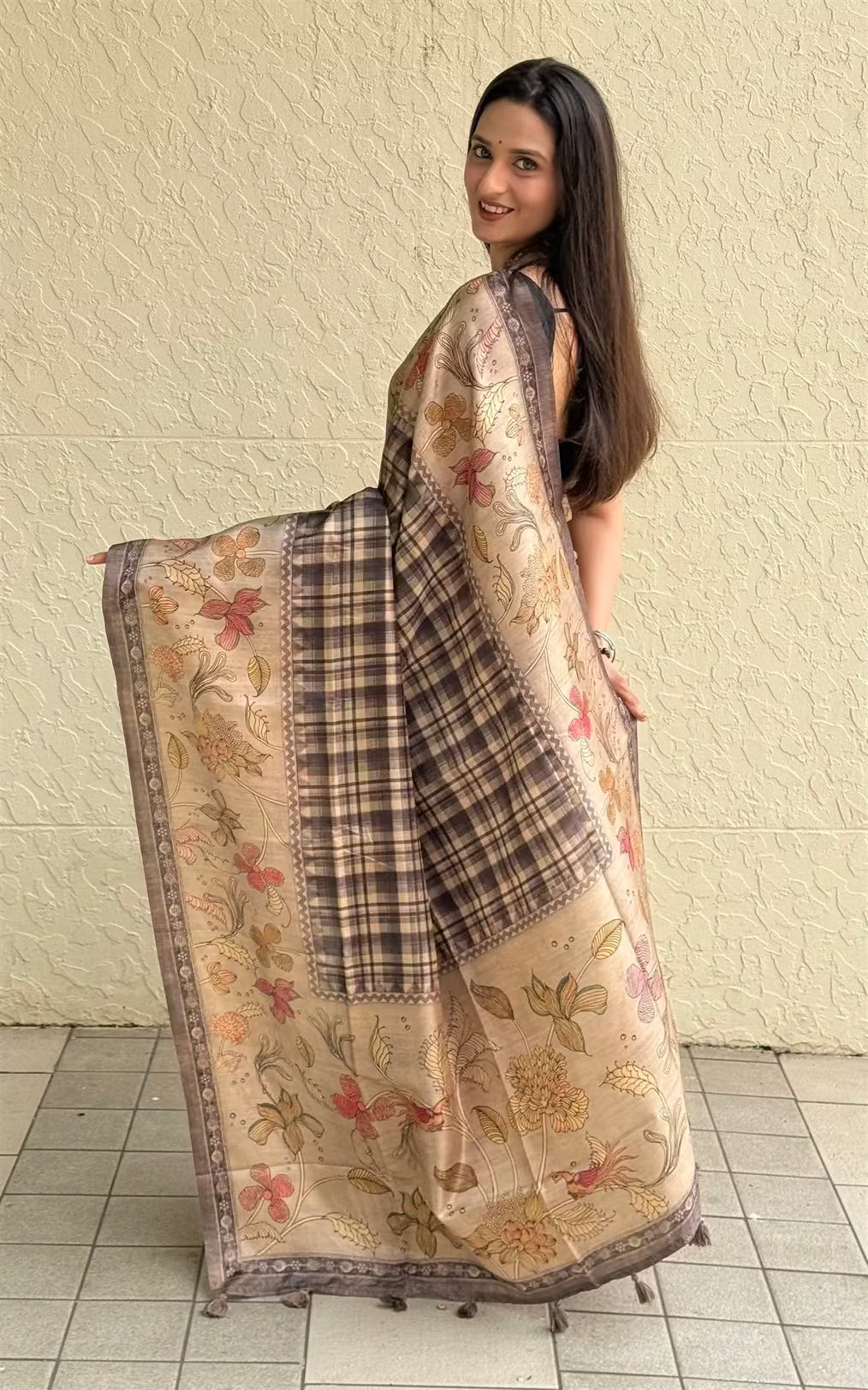 Woman in Chex Pattern with Floral Border orint saree.