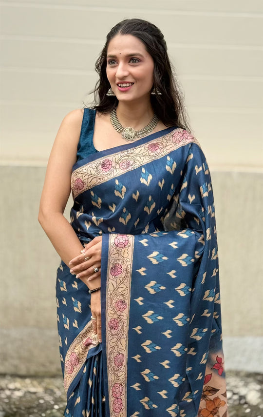 Woman in Blue Colour Ikkat Butti print saree.