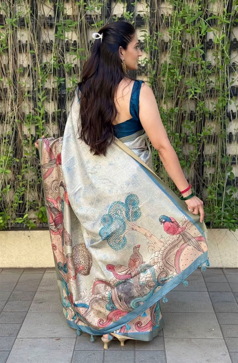 Woman wearing saree showing Bird Kalamkari Pallu detailing.