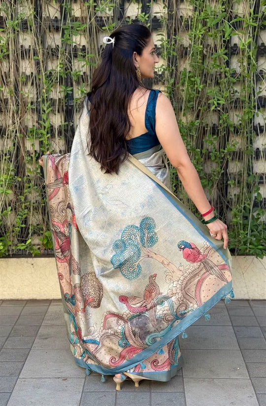 Woman wearing saree showing Bird Kalamkari Pallu detailing.