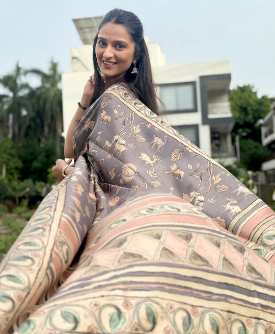 Woman wearing a Gray Tone Floral With Animal Pattern print saree.