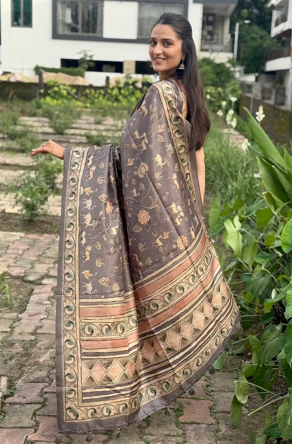 Woman in Floral With Animal Pattern print saree.