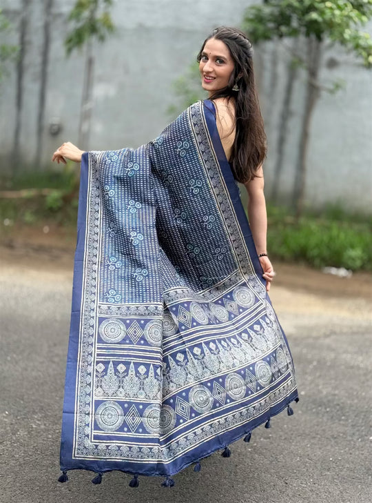 Woman in Indigo Ajrakh Butti with Geometric printed pallu saree.