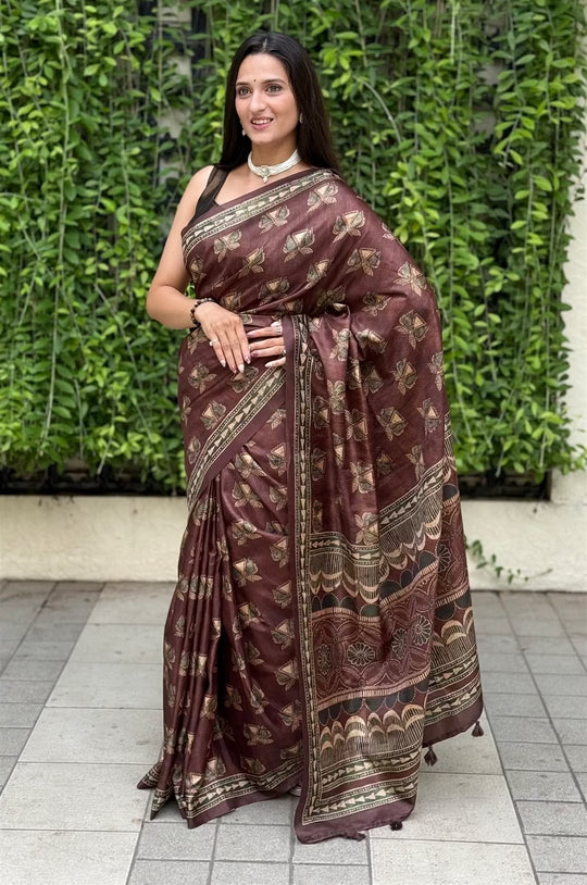 Woman wearing a Ajrakh Pattern in Brown Colour with Geometric print pallu.