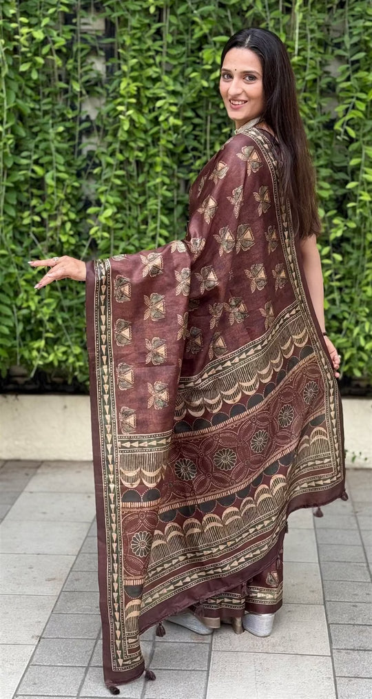 Woman in Ajrakh Pattern in Brown Colour print saree.
