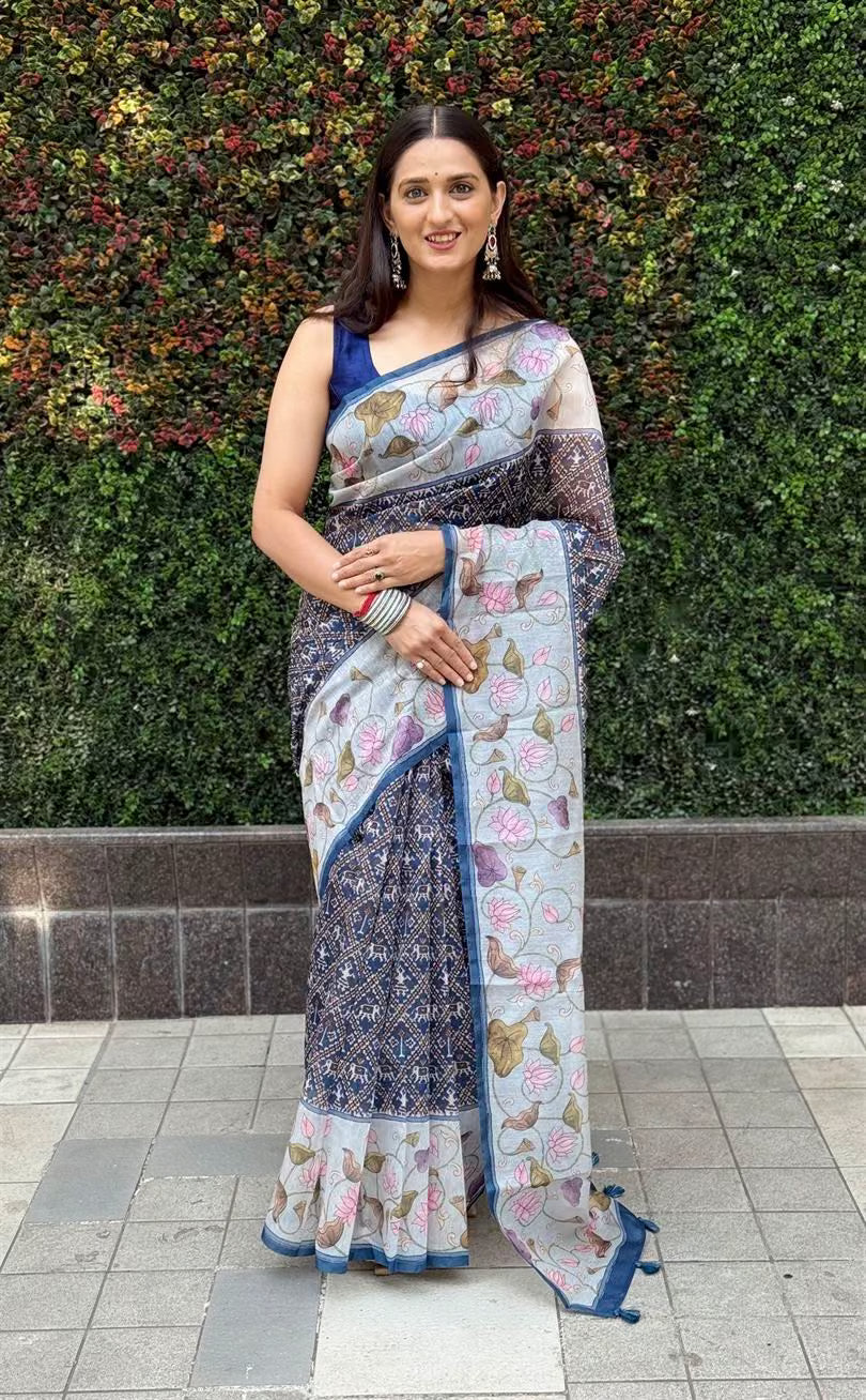 Woman wearing Lotus Kalamkari Border Saree with Patola Print.