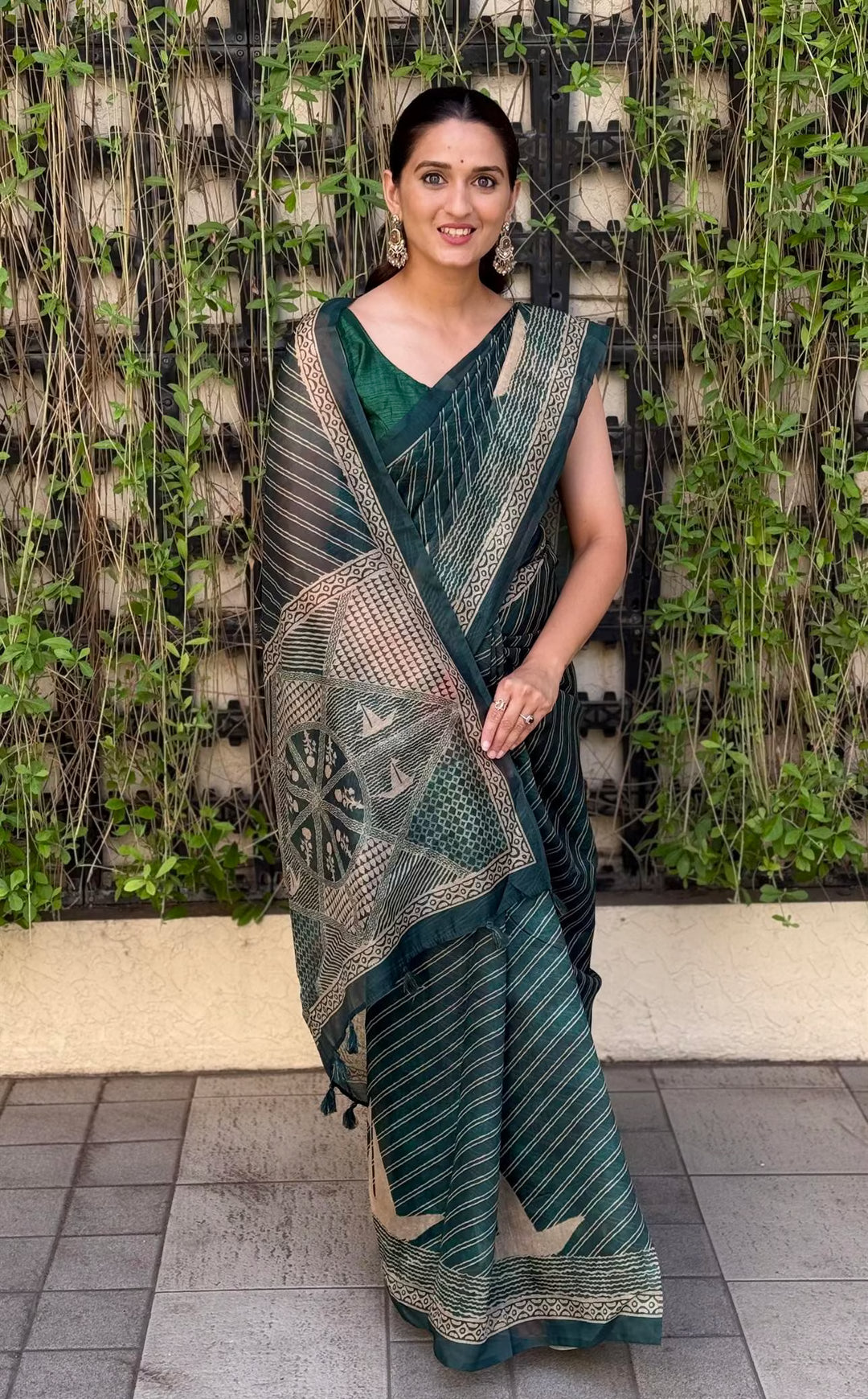 Woman in Dark Green Colour Saree by Ethnic Today.