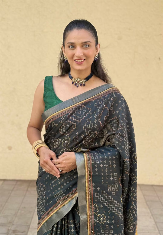 Woman in Green & Yellow Bandhani Katha Dola Silk Saree.