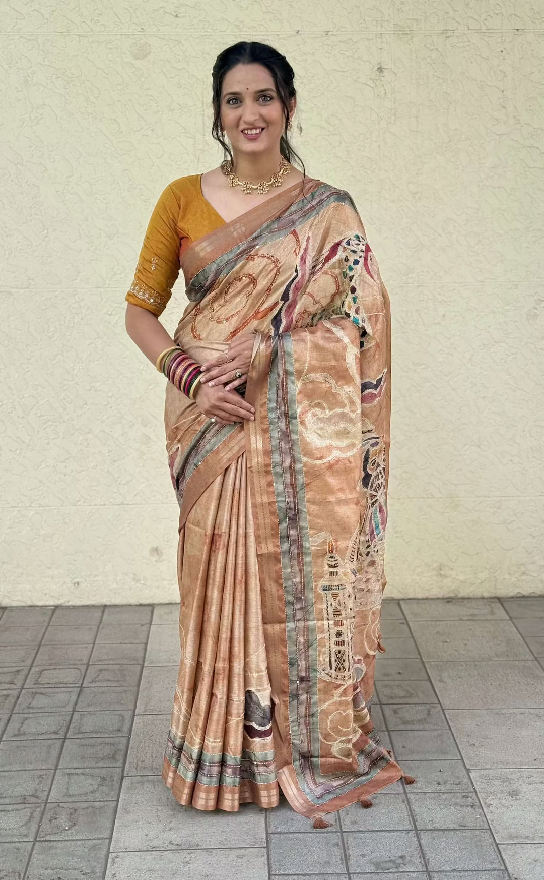 Woman in Abstract Print & Kalamkari Pallu Saree with Zari border. 