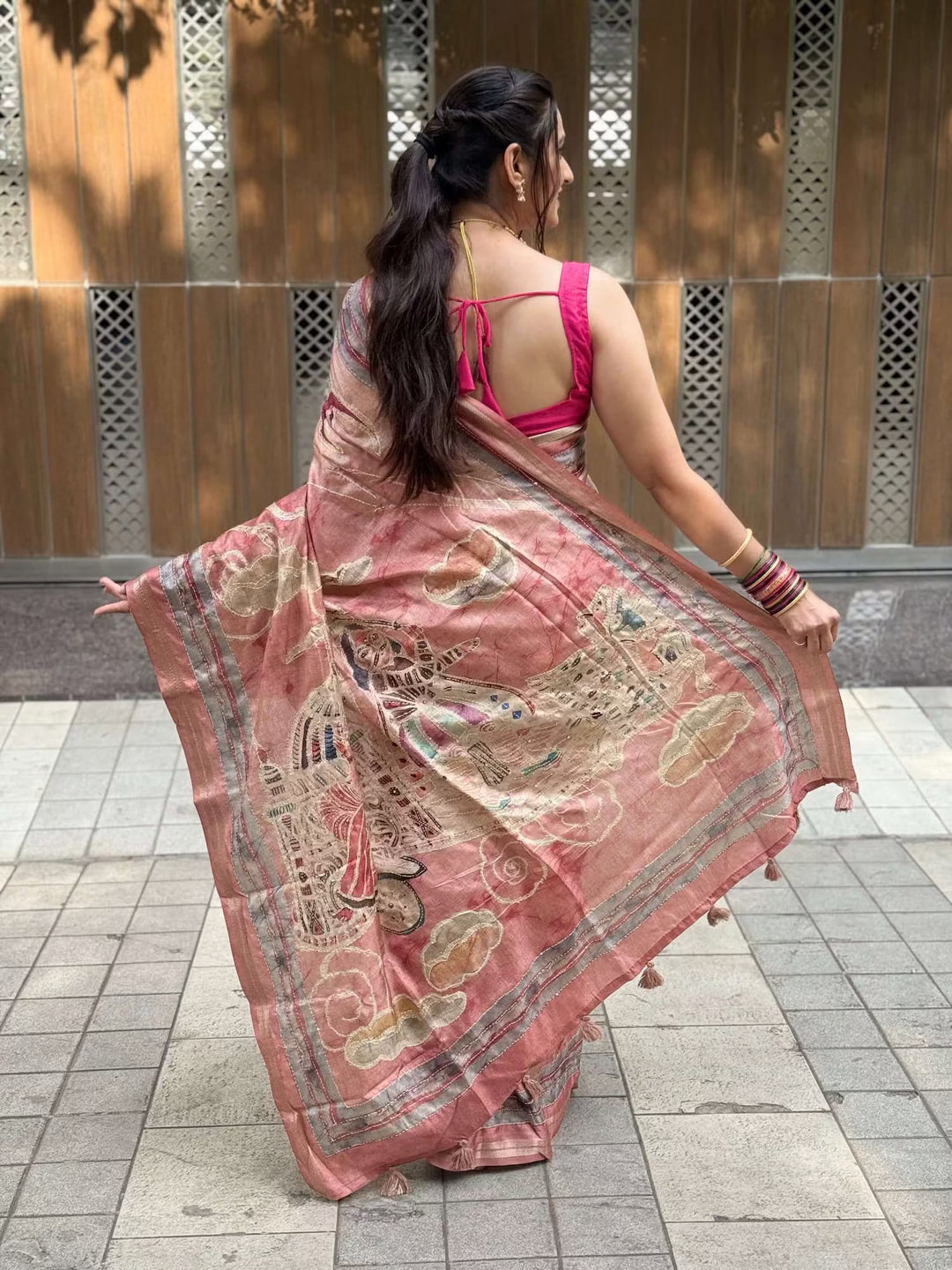 Woman wearing Rosewood Pink Kalamkari Art Pallu Silk Saree.
