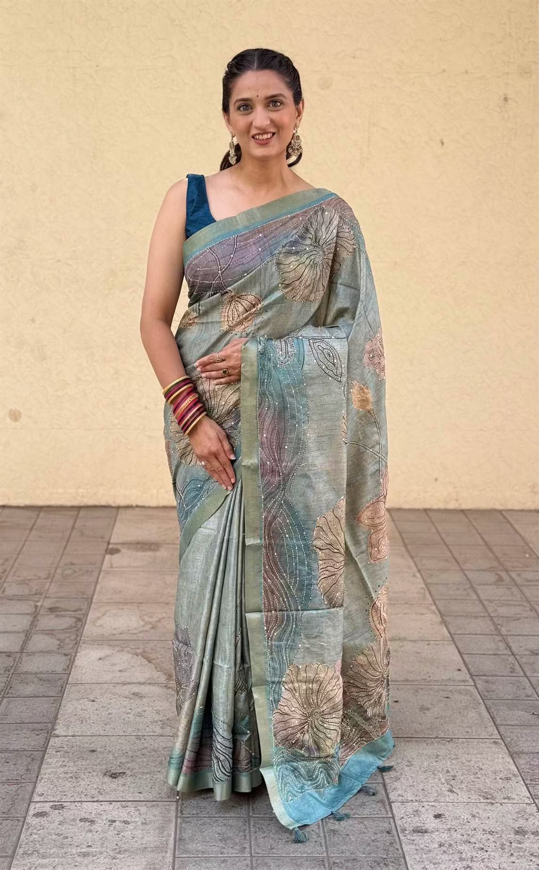 Woman wearing a traditional saree by Ethnic Today.