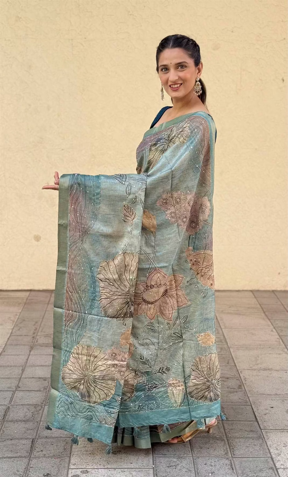 Woman in Aqua Cyan Floral Katha Dola Silk Saree by Ethnic Today.