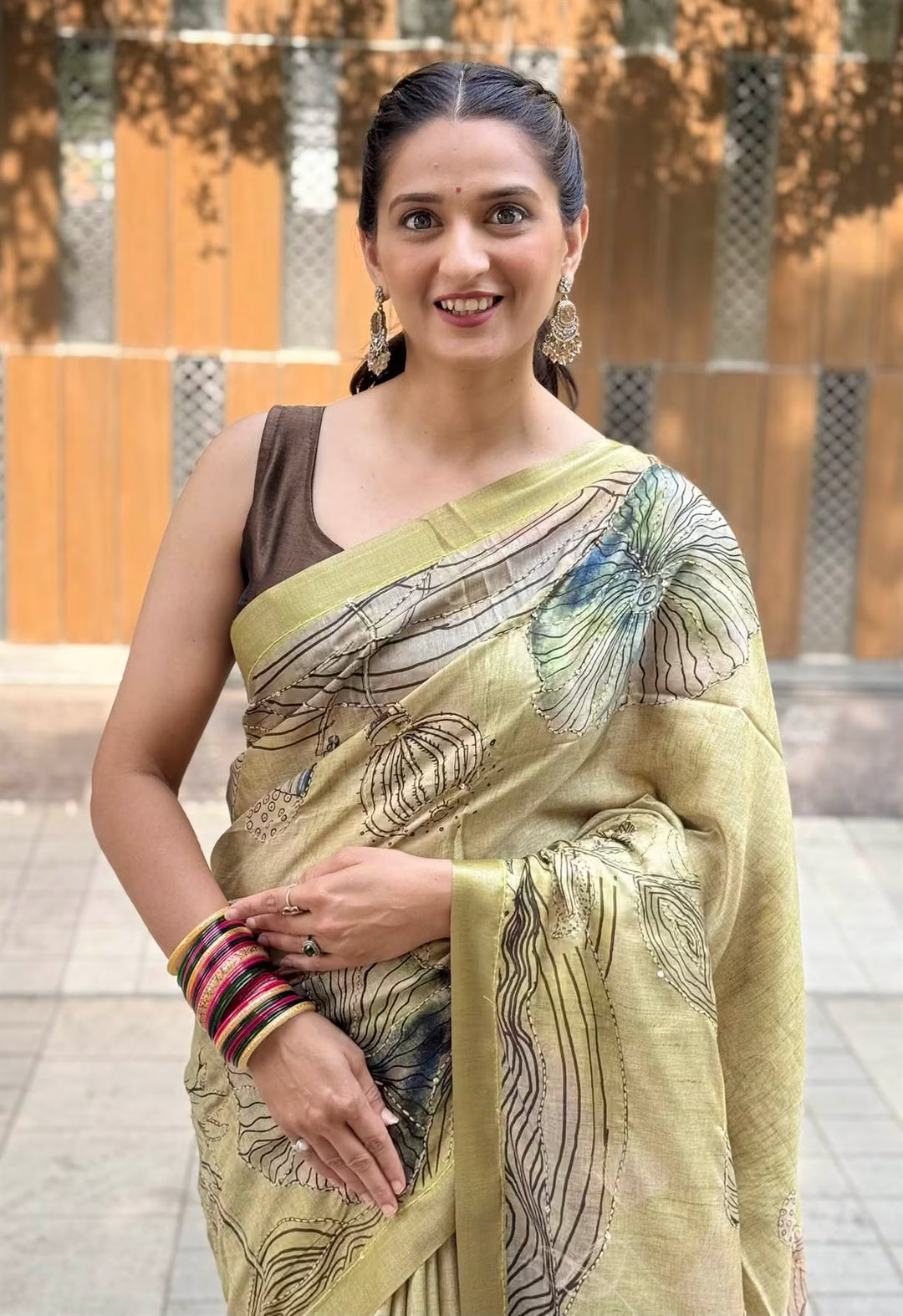Woman in Green Botanical Katha Dola Silk Saree.