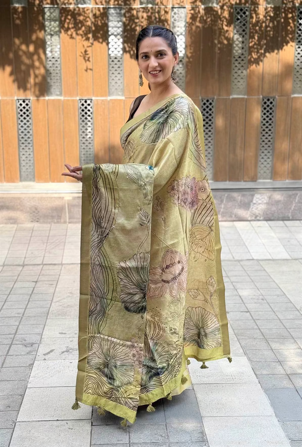 Woman wearing Green Botanical Katha Dola Silk Saree by Ethnic Today.
