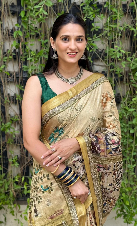 Woman in Mustard Gold Madhubani Dola Silk Saree.
