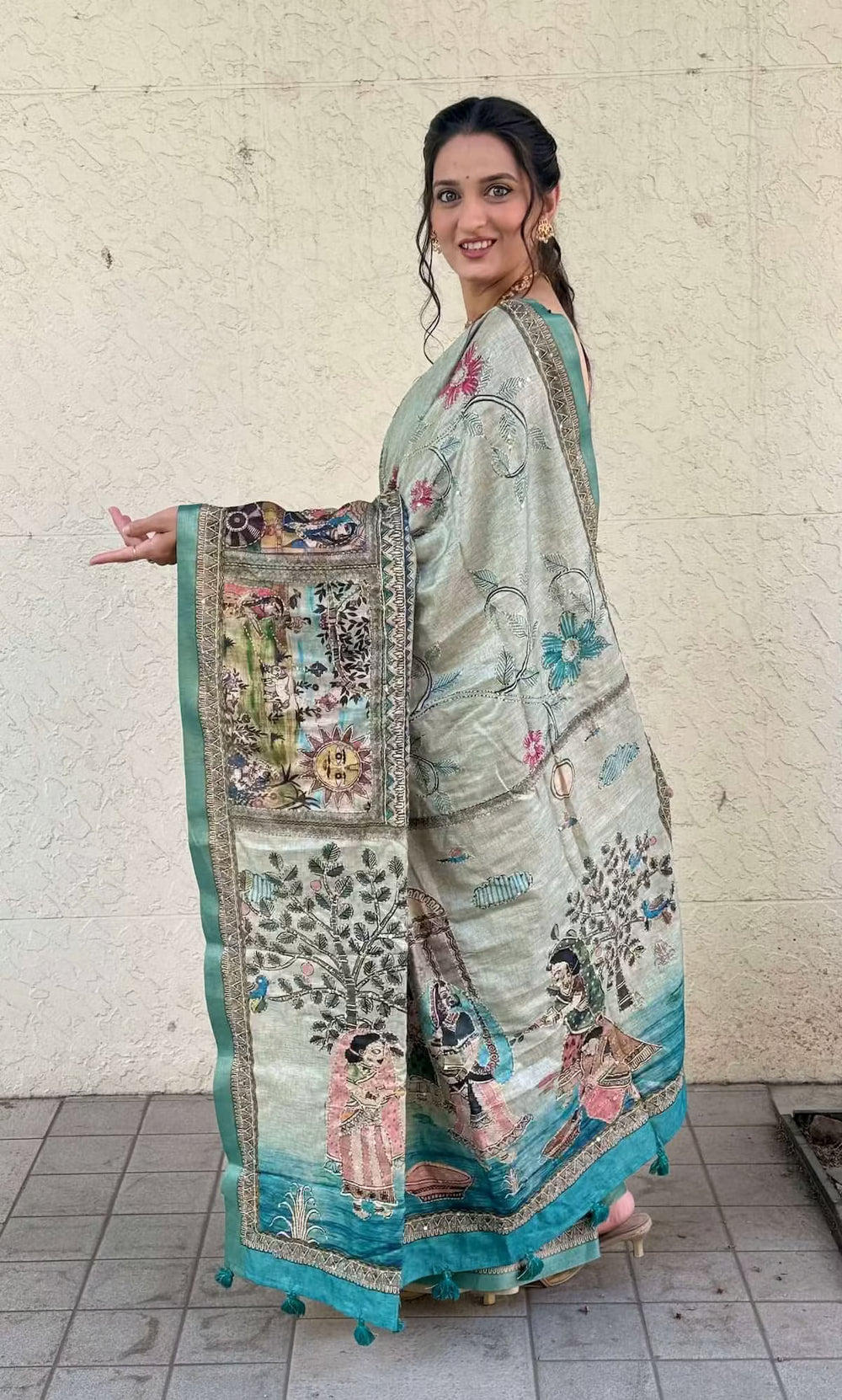 Woman wearingSea Blue Madhubani Katha Dola Silk Saree by Ethnic Today.