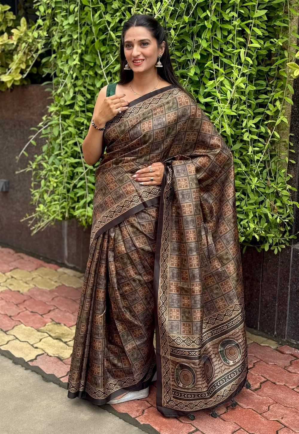 Woman in Black Ajrakh Checkered print Tussar silk saree.