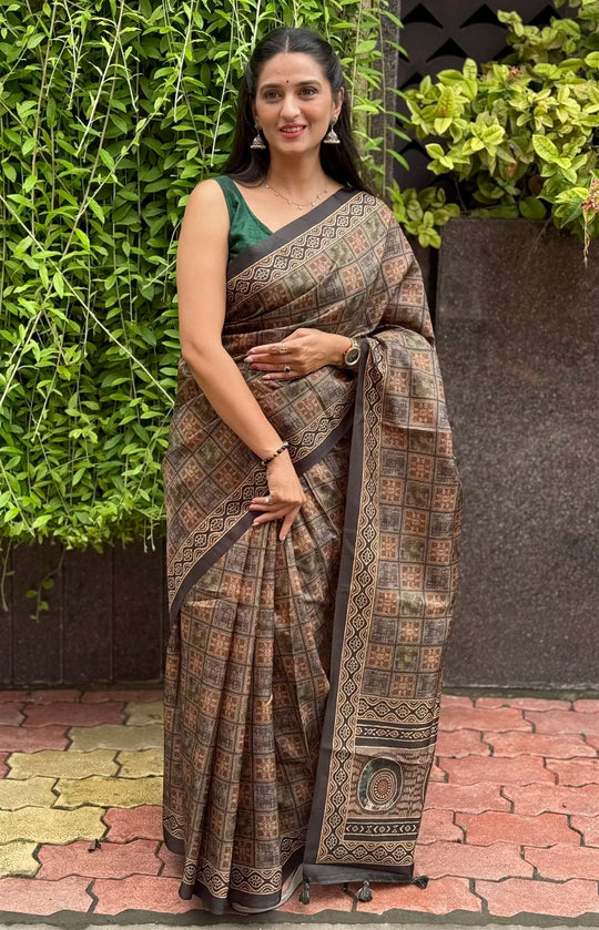 Woman wearing a Black Ajrakh Checkered Print tussar silk saree.