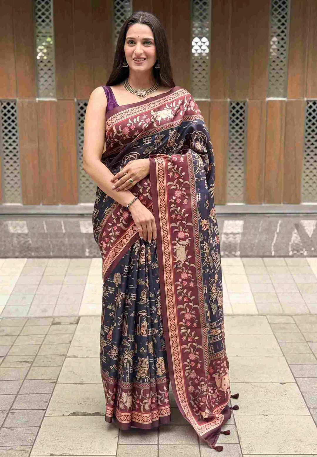 Woman wearing Lotus & Cow Designer Pichwai Chanderi printed saree.			