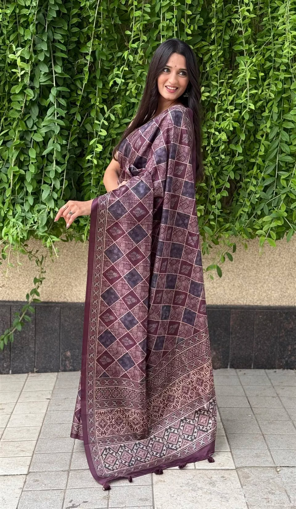 Woman in Ajrakh pattern with Traditional Block inspired motifs saree.