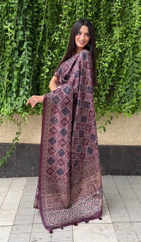 Woman in Ajrakh pattern with Traditional Block inspired motifs saree.