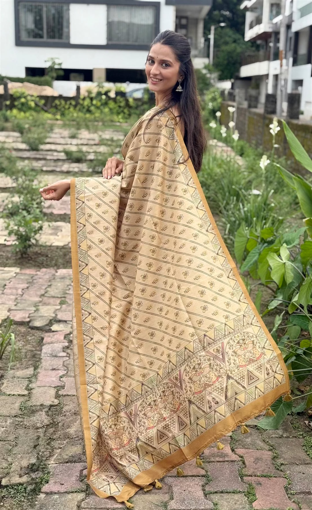 Woman in Printed saree with Madhubani style border.