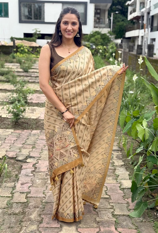 Woman wearing a Printed saree with Madhubani style border.