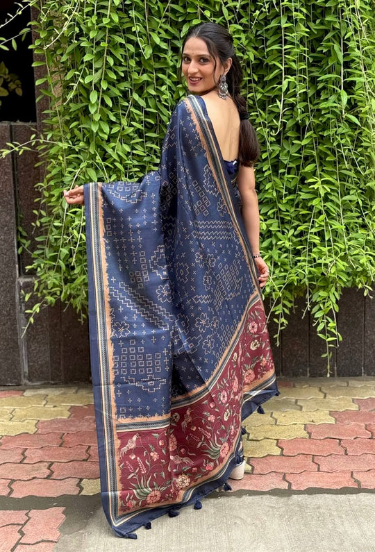 Woman in Bandhani With Maroon Kalamkari Pallu saree.