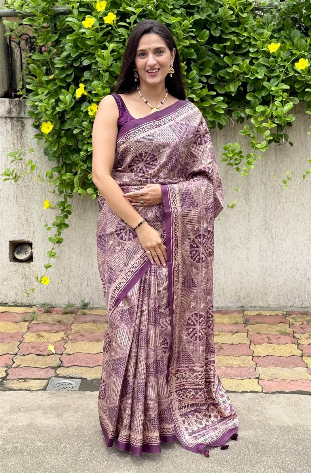 Woman wearing a Purple Base with Geometric Beige Pattern saree.