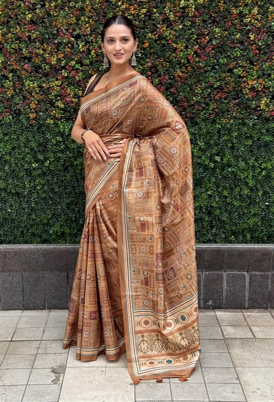 Woman wearing a Brown shade with Geometric and Tribal inspired motif saree.