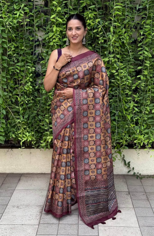 Woman wearing a Multi Colour Ajrakh Print with Maroon border saree.