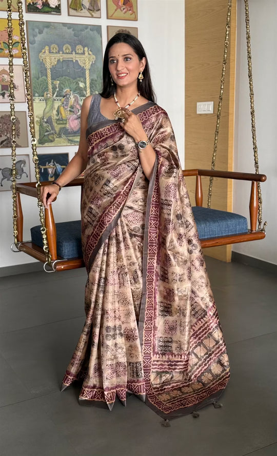 Woman wearing a Block Print Beige Colour Tussar Silk Saree.