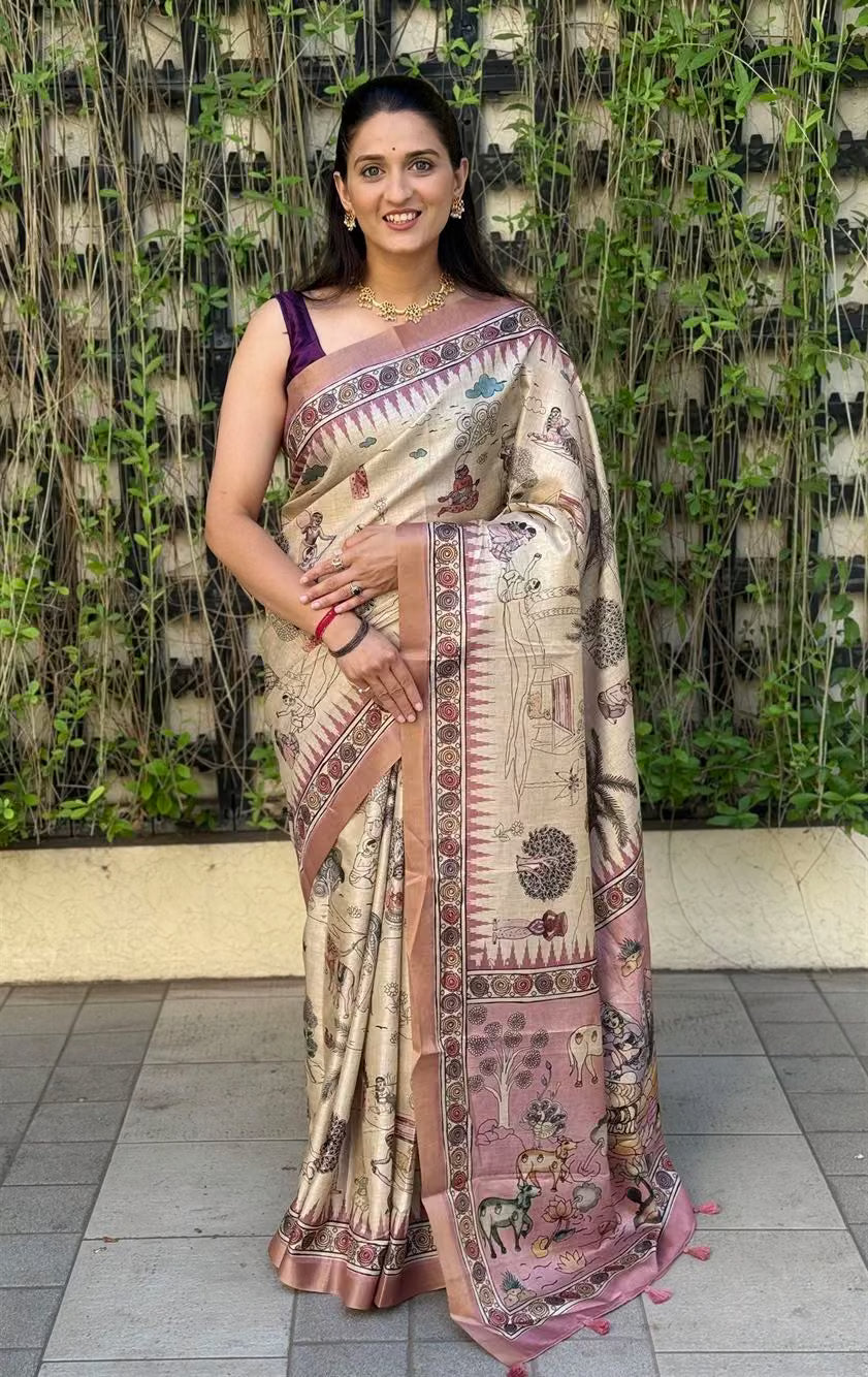 Woman wearing Kalamkari Garden Cream Silk Saree with Zari Border.