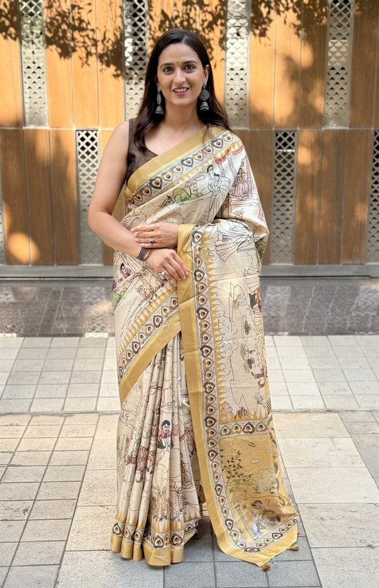 Woman wearing a traditional saree in Kalamkari Print.
