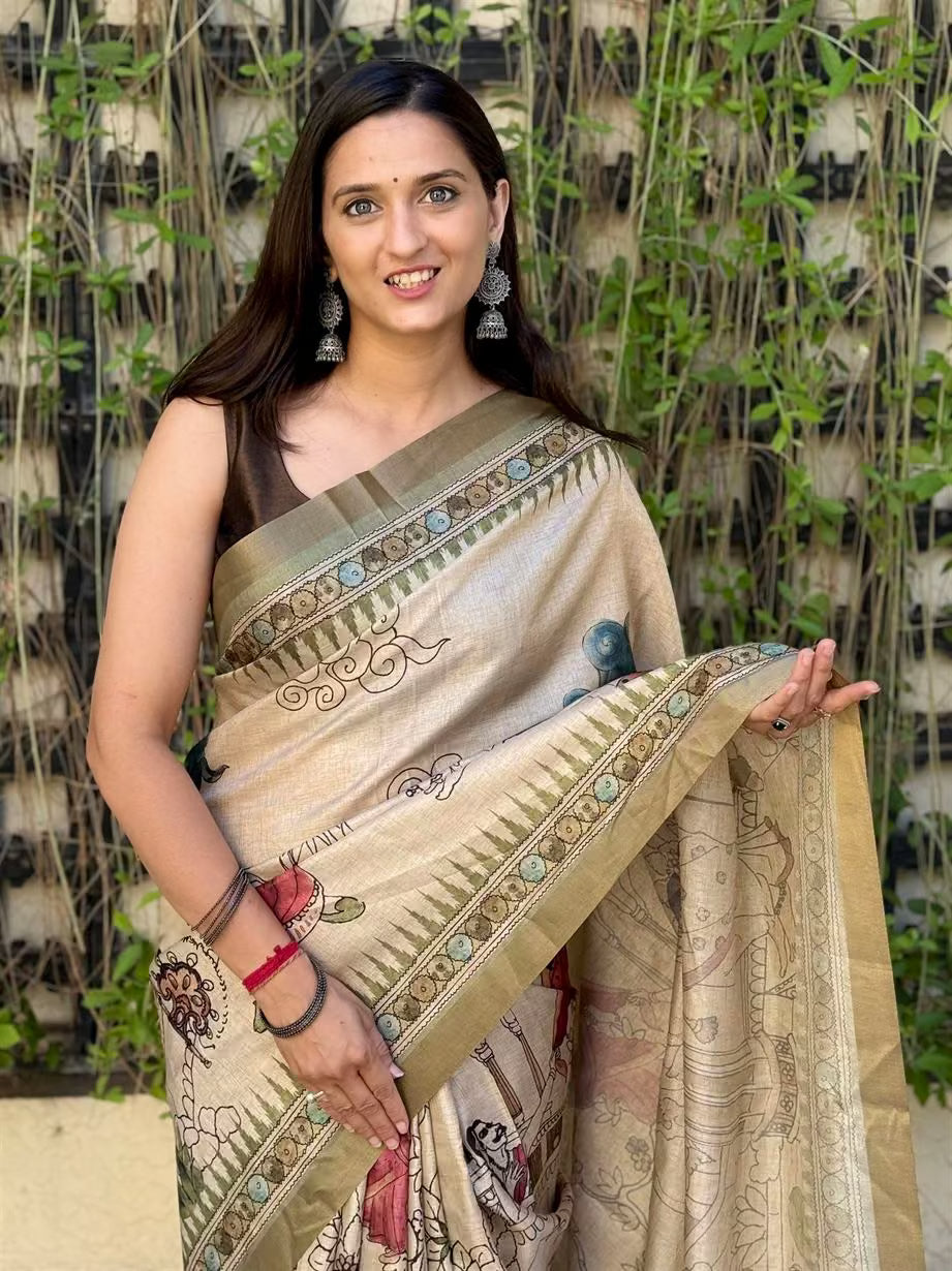 Woman wearing Kalamkari Folk Print With Zari Border Silk Saree.