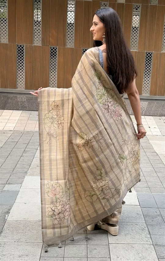Woman in Lotus with Stripe in Beige colour saree.