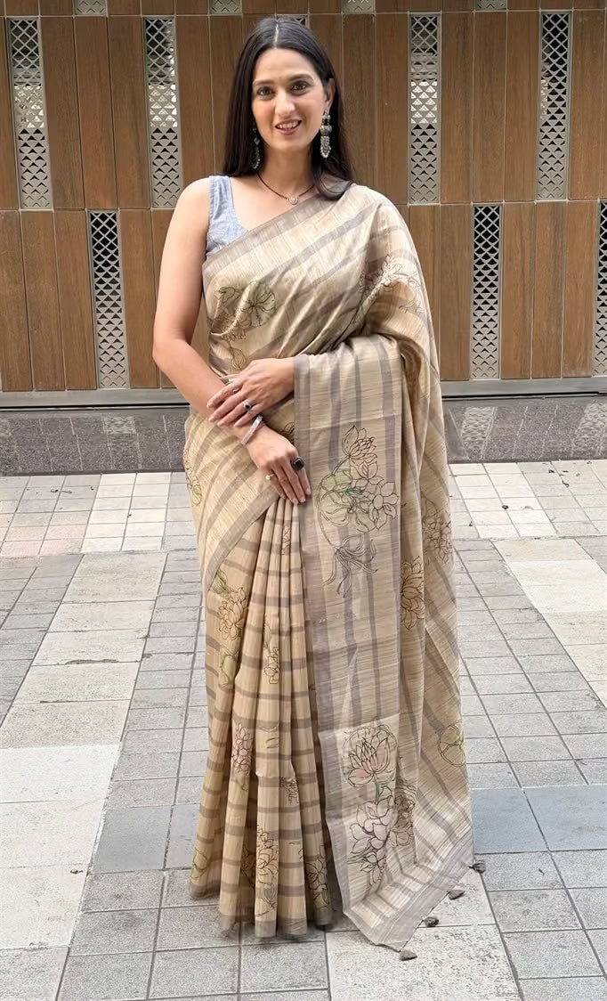 Woman wearing a  Lotus with Stripe in Beige colour saree.