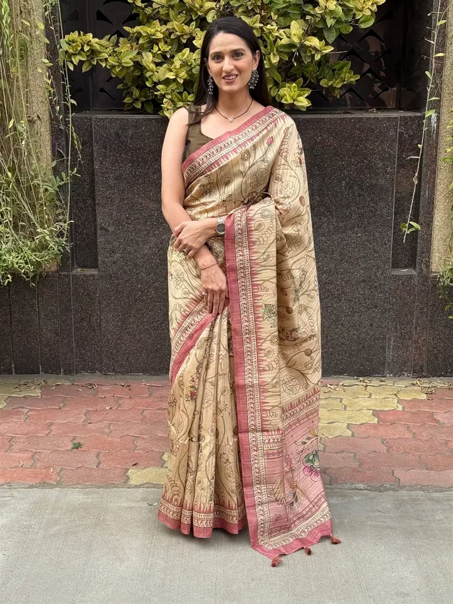 Woman wearing a Kalamkari Beige Base With Pink Pallu.