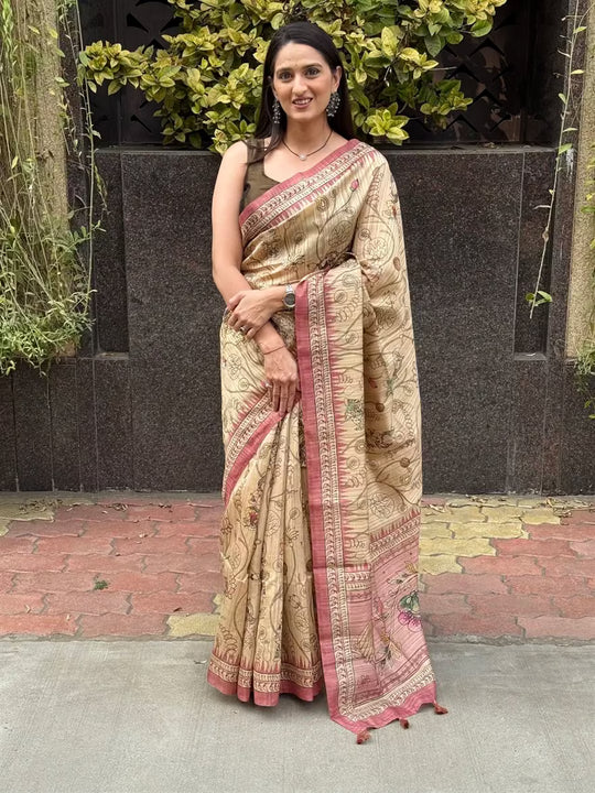 Woman wearing a Kalamkari Beige Base With Pink Pallu.