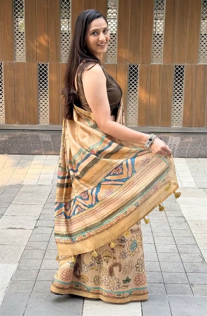 Woman wearing a Beige Floral Figure printed Soft silk saree for woman.