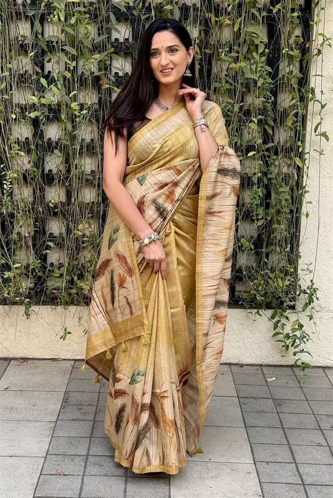 Woman wearing a Golden Yellow Botanical printed saree.