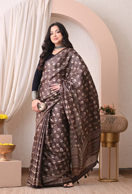 Woman wearing a Dark Brown Ajrakh Butti print saree.
