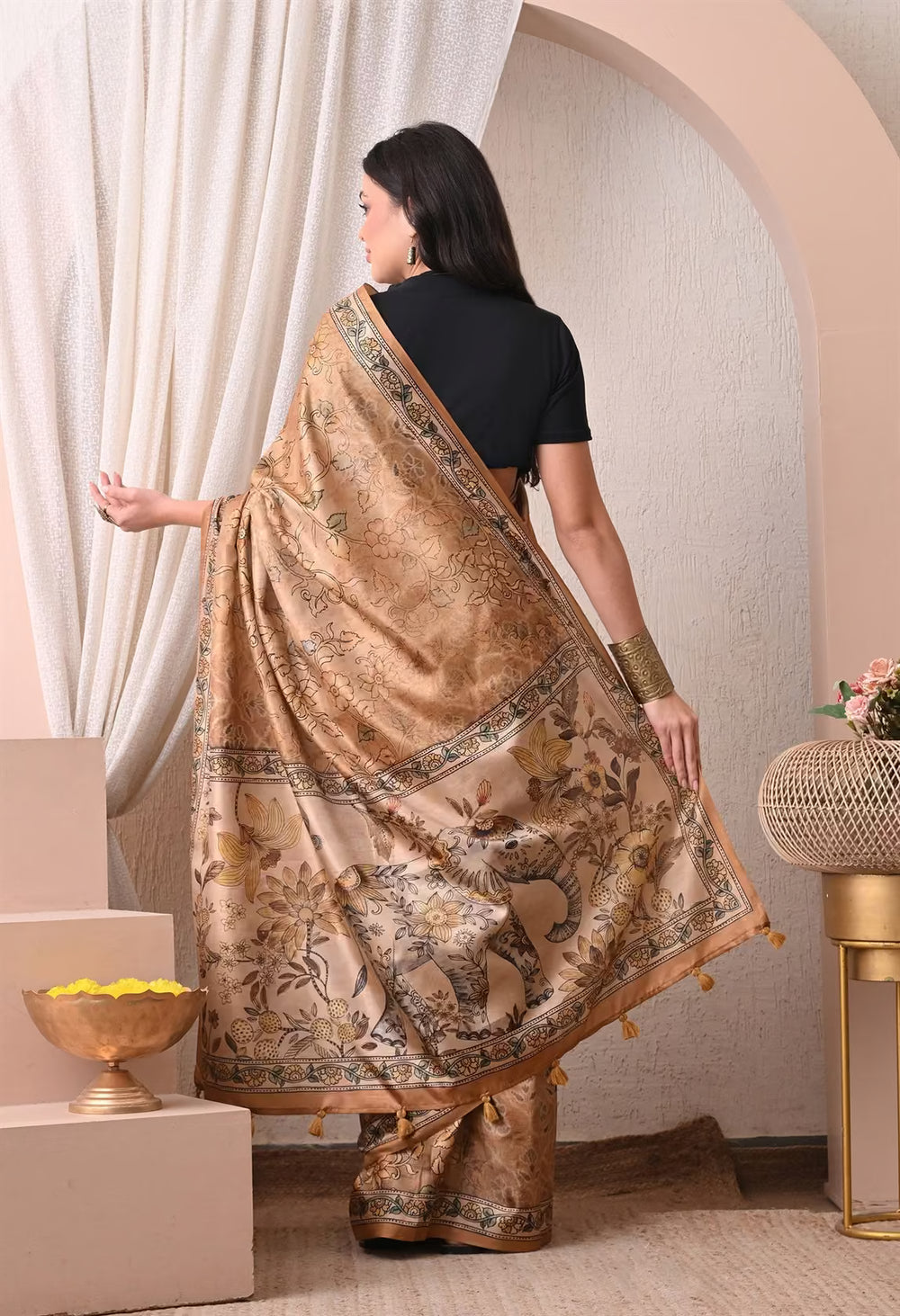 Woman in Yellow Elephant Pallu Kalamkari print saree.